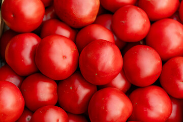 Bunch of fresh red tomatoes background.