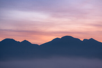 Fototapeta premium sunrise over mountains in cansiglio dolomites Italy