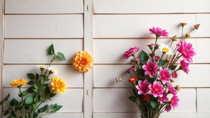 Fototapeta premium Vintage style artificial flowers wall background with assorted colorful flowers, green leaves, and rustic wooden frame, retro, colorful