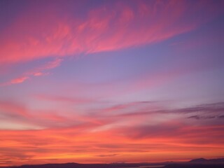 Vibrant hues of pink, orange, and purple merging in a breathtaking display of color in the sky at sunset, nature, tranquil, background