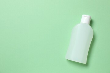 Cosmetoc bottle on a colored background