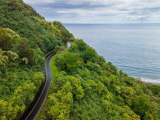 Bird view to the Hawaiian Island of Maui and fly with me along the road to Hana which is embedded into a green rainforest jungle
