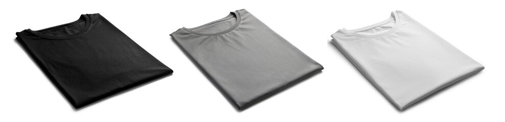 White, grey and black folded t-shirts isolated on white. Mockup for design