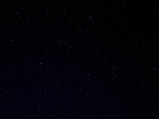 Obraz premium Night sky filled with twinkling stars on a deep black background, tranquil, dark