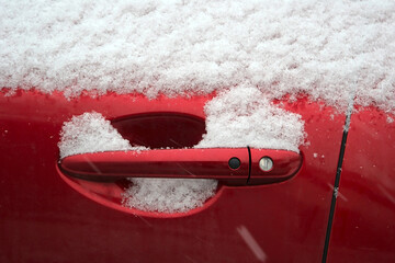 a snowy red car (fragment)