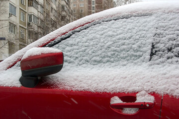 a snowy red car (fragment)
