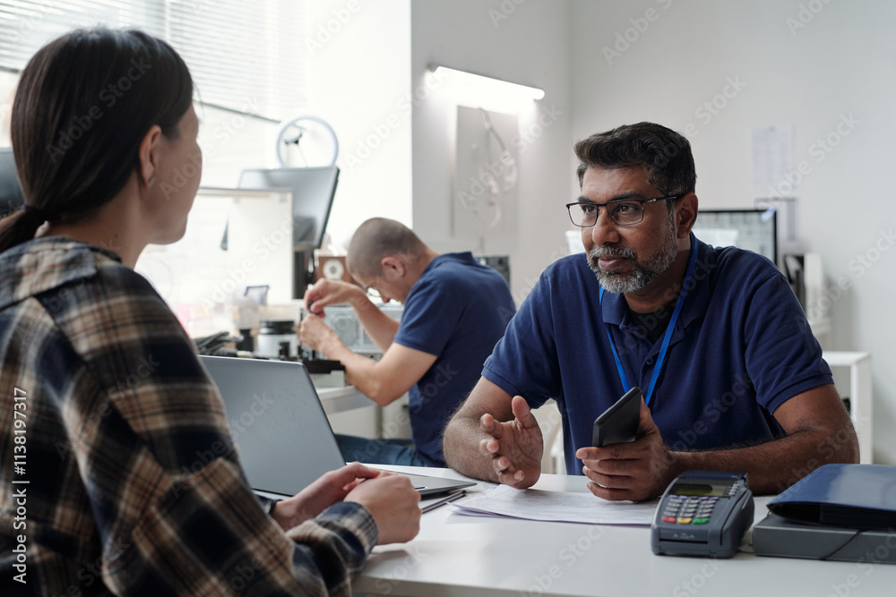 Poster discussing work with colleague in office environment