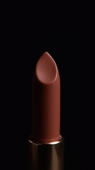 close-up mocha mousse lipstick on black background, place for text, banner for cosmetics store, make-up, brown, trend colour 2025