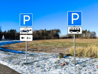 Close-up: road signs parking electric car. Road sign parking on a sunny winter day.