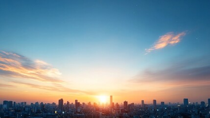 City skyline at sunset with colorful clouds.
