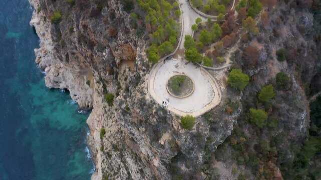Aerial view of the wonderful Cala del Moraig and Cala de los Tiestos, located between the beautiful cliffs of the town of Benitachell, in the Mediterranean province of Alicante, Spain.