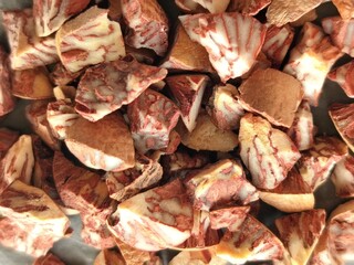 Betel nut cutted in small pieces Betel nut, also known as areca nut, is the seed of the Areca catechu tree, a species of palm tree that grows in parts of the tropical Pacific Islands, Asia, and Africa