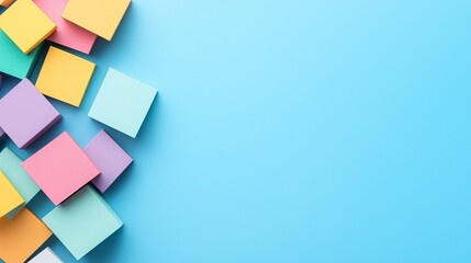 Colorful sticky notes scattered on a blue background create a vibrant office or creative workspace feel.