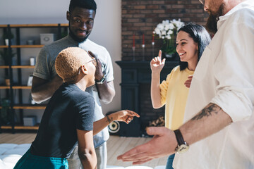 Pleased multiracial friends at modern home