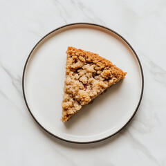 A single slice of homemade plum crumble cake with golden-brown crunchy topping and visible fruit filling, served on a clean white plate on marble surface