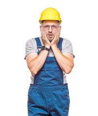 Mistake. Worried middle-aged construction worker holding her hands on head. Remember - forgot concept, isolated on white background. Craftsman against white wall