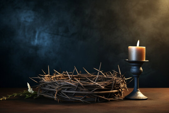 Thorns of crown of Jesus Christ with candle light in the night on dark black background. The holy week of Easter concept. Good Friday.