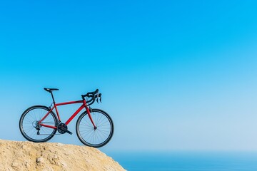 Red road bike overlooking ocean