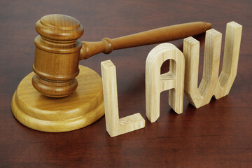 Judge gavel and word LAW close up. Law and legal system concept.
