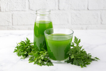 Green healthy detox, lemon and parsley juice. Green vegetable smoothie