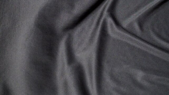 waving of black fabric, texture background