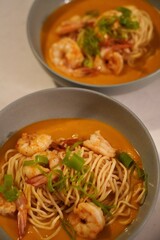 ginger and scallion prawn bisque with yimien noodles