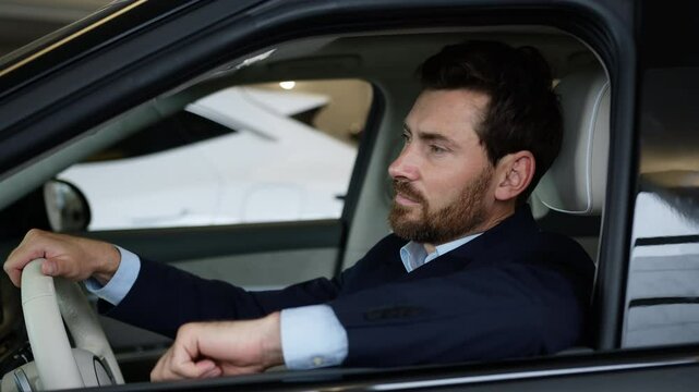 Successful confident Caucasian man businessman new car ownership male salon automobile transport buying purchaser customer electric luxury auto looking at camera business client sitting driving guy