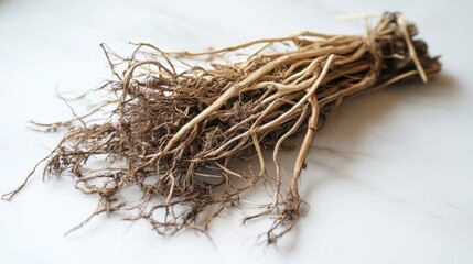 Natural dried vetiver roots spread out on a pristine white surface, emphasizing their rustic, earthy appearance in vivid detail