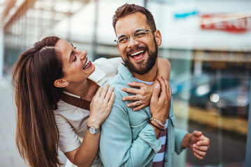Happy Couple Laughing and Enjoying Time Together in a Urban Setting