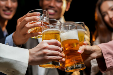 food and drink male friends are happy drinking beer and clinking glasses at a bar or pub.