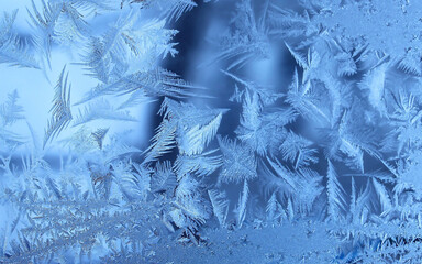 Natural frosty glass blue ice a winter close up background,  Natural frozen Pattern. Winter...