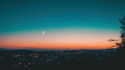 Serene Sunset with Crescent Moon Over a Cityscape