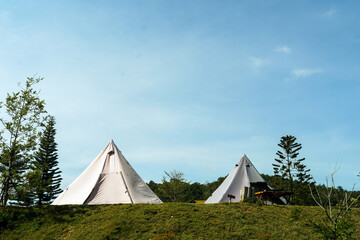 tent, relaxation, glampsite, morning sunlight, morning, outdoors, A beautiful glamping tent sitting in the morning sunlight surrounded by a breathtaking panorama of mountain ranges