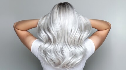 Naklejka premium A platinum balayage hairstyle with soft transitions into silver tones.