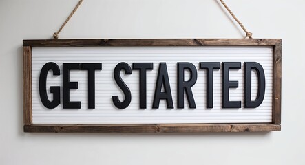 Obraz premium Get started lettering on hanging sign board on plain white background