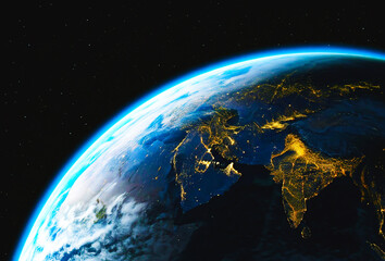 Obraz premium Earth from Above: Illuminated Cities and Clouded Skies