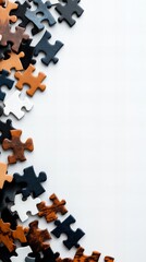 A corner of a scattered jigsaw puzzle featuring various shades of brown and black pieces against a white background.