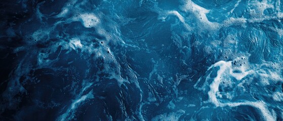 Obraz premium Close-up of an abstract blue water texture background with sunlight reflection and ripples in a swimming pool, top view. A summer concept for a banner or backdrop design