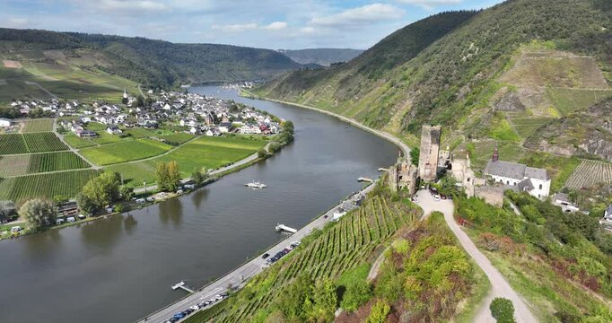 Aerial footage of the ruins of Metternich Castle overlooking the Moselle River in Beilstein, Germany
