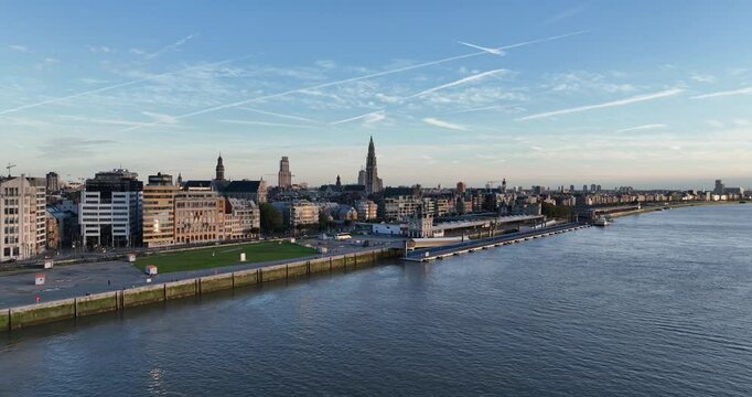 Drone footage of the city view of Antwerp at sunset with the skyline at the Scheldt River, Belgium