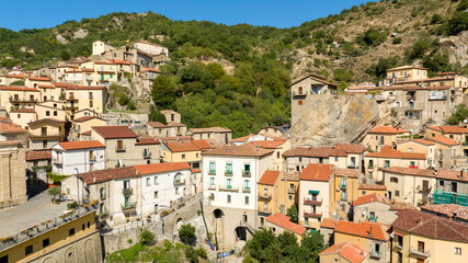 Fototapeta premium Aerial view of houses and buildings in Castelmezzano, in the province of Potenza, Basilicata, Italy. It is a town built on a mountain in the Dolomiti Lucane park.
