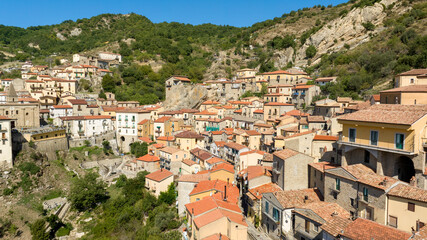 Aerial view of houses and buildings in Castelmezzano, in the province of Potenza, Basilicata, Italy. It is a town built on a mountain in the Dolomiti Lucane park.