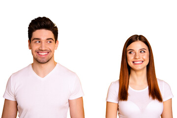 Close up photo two amazing beautiful she her he him his couple standing side by side look each other did trick funky childish mood wear casual white t-shirts outfit clothes isolated yellow background