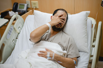 A male influenza patient is stressed about his symptoms.