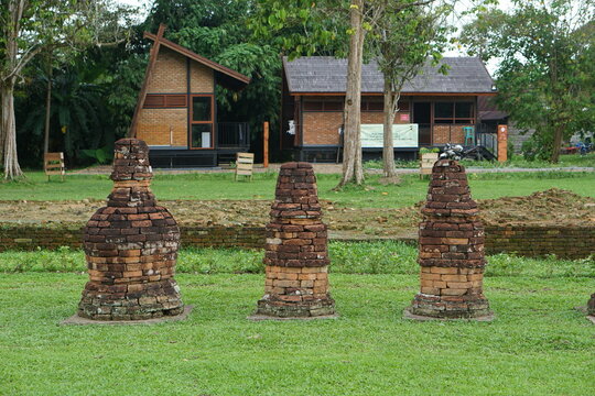 Jambi, Indonesia - April 17th 2024 : several small temples in the Muaro Jambi Indonesian temple complex, relics of Buddhist civilization, ancient architecture, in the afternoon