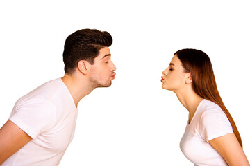 Close up side profile photo amazing beautiful she her he him his guy lady bonding ahead each other need kisses tenderness spread lips wear casual white t-shirts outfit isolated yellow background