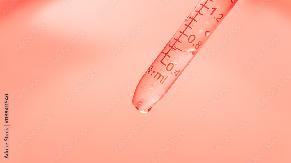 Wall mural pink science test tube macro,inclined test tube with transparent liquid and lab dropper inside on pi