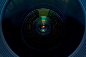Close-up macro lens glass front,Close up detail of a professional photocamera in a studio environment, no people are visible.
