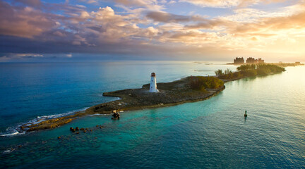 Nassau, Bahamas at dawn with the Hog Island Lighthouse in the foreground.