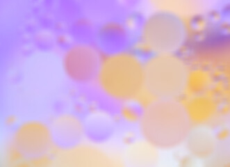 Blurry abstract background with soft pastel gradients in purple, pink, and orange tones, featuring glowing bokeh circles for a dreamy and soothing effect. 